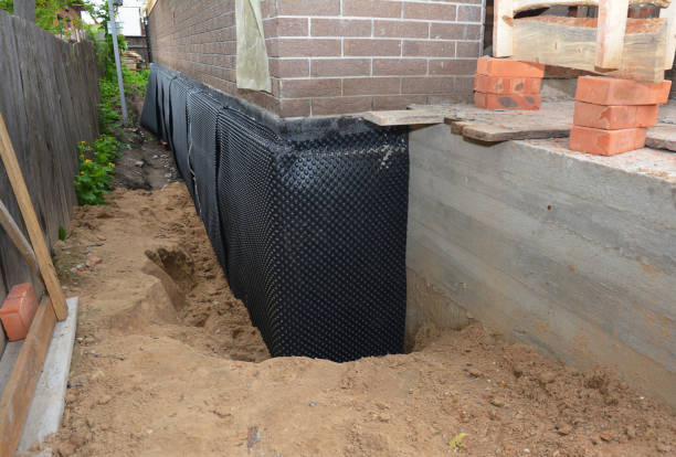 SJ Waterproofing Pros technician performing targeted Basement Waterproofing assessment in Decatur, GA